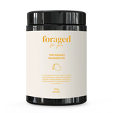 A black plastic supplement jar with a cream-colored label reading 'foraged for you' and 'THE MANGO MAGNESIUM' on a white background.